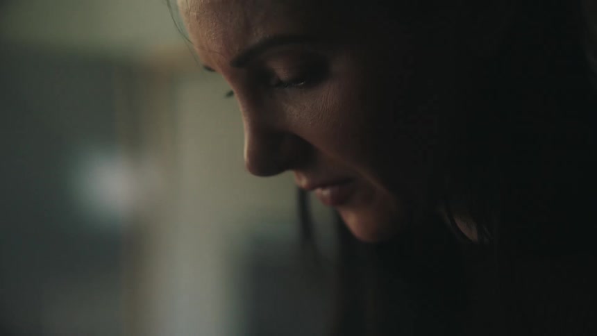 Close up of sad womans face looking down