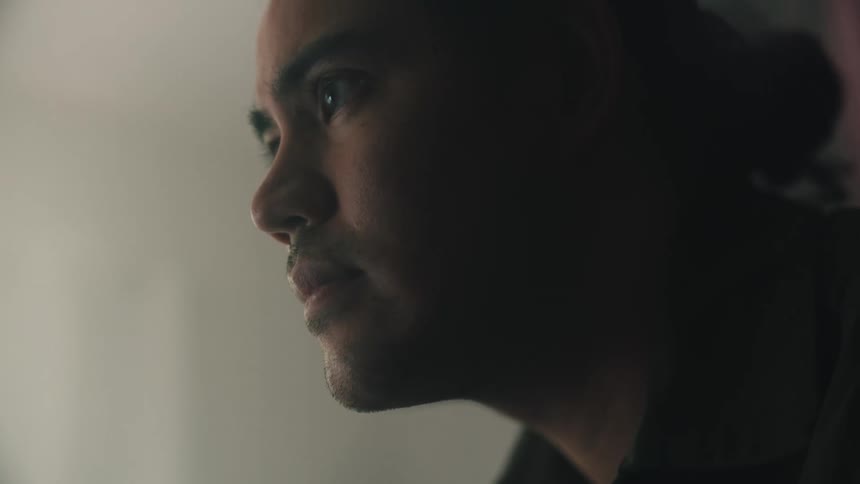 A sad man staring at nothing in front of him
