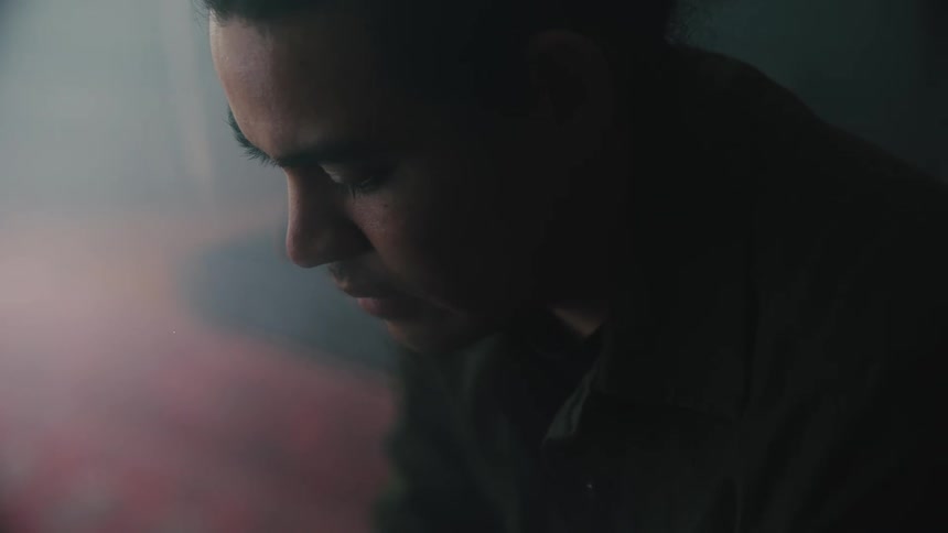 A man looks worried and is thinking about something while looking at the ground