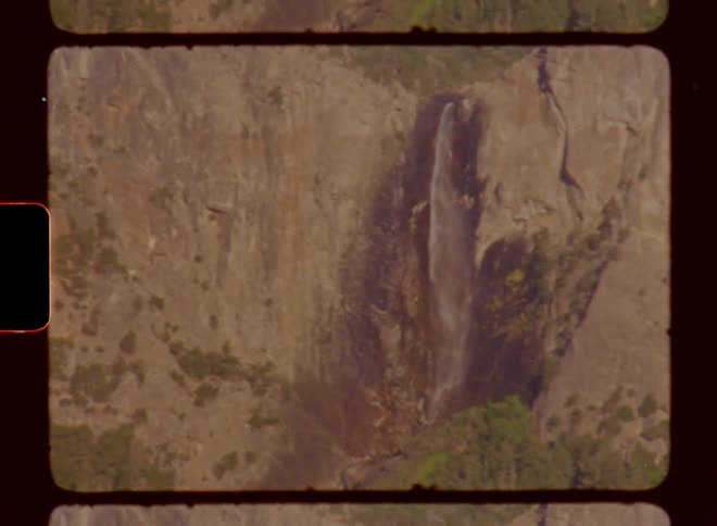 Waterfall flowing down the cliff of a mountain
