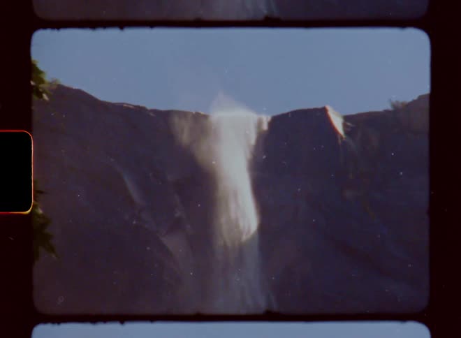 Waterfall in free fall against a blue sky