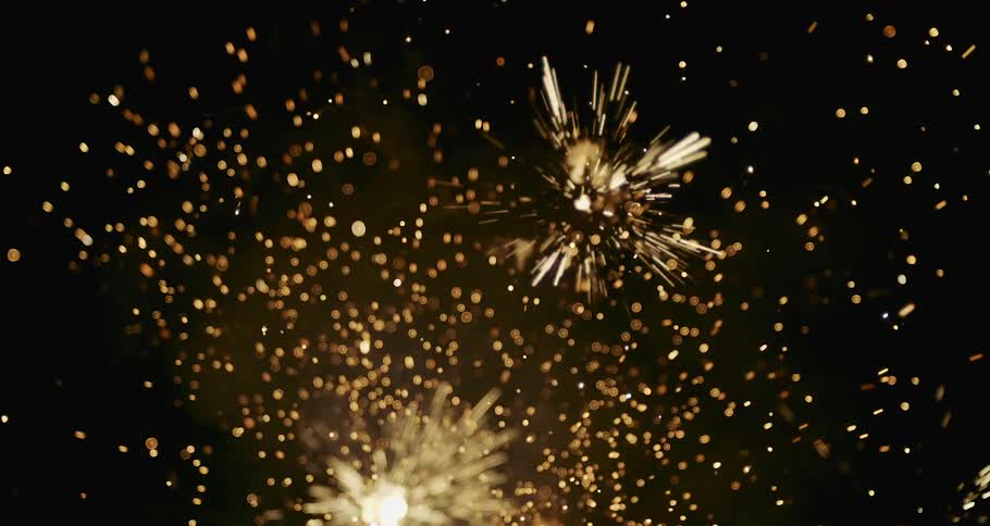 Fireworks releasing sparks into the night sky