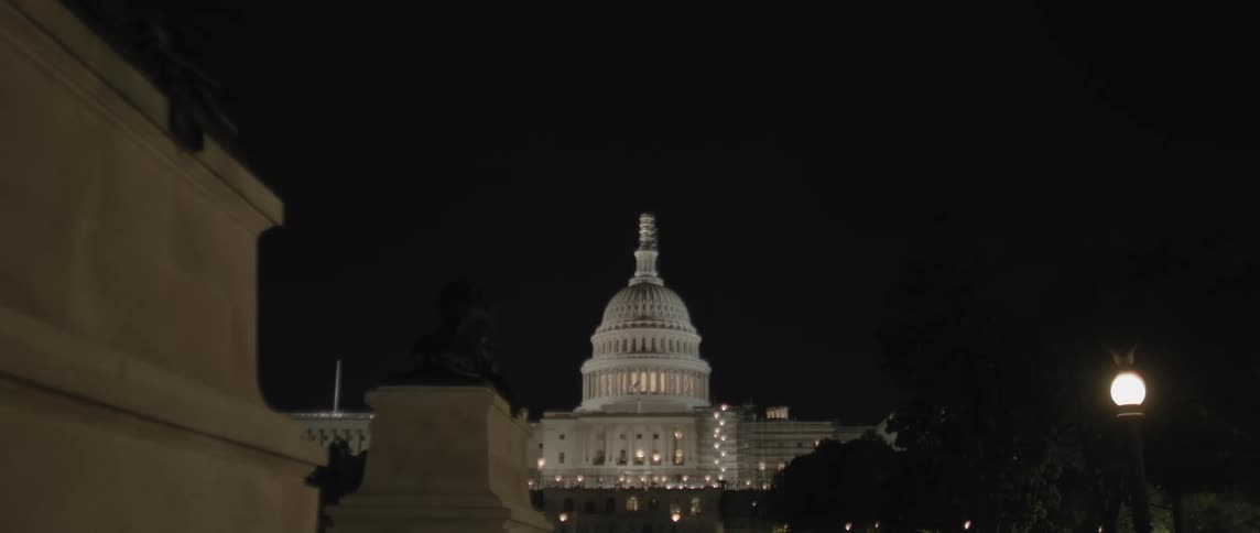 Exterior view of the majestic united states capitol illuminated against the backdrop of the night sky