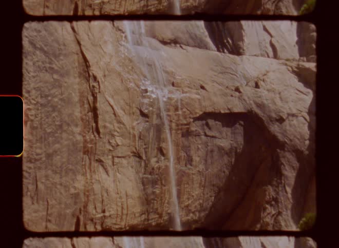 Waterfall flowing on the rock face of a mountain