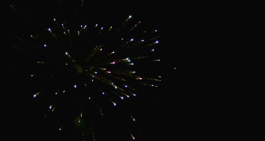 Fireworks exploding in the night sky in slow motion