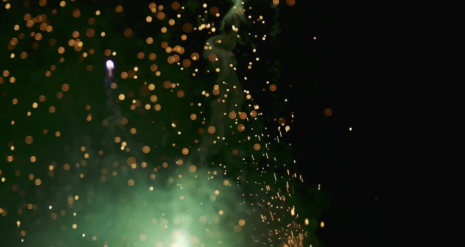 A dazzling fireworks display illuminates the night sky with bright and flashy bursts
