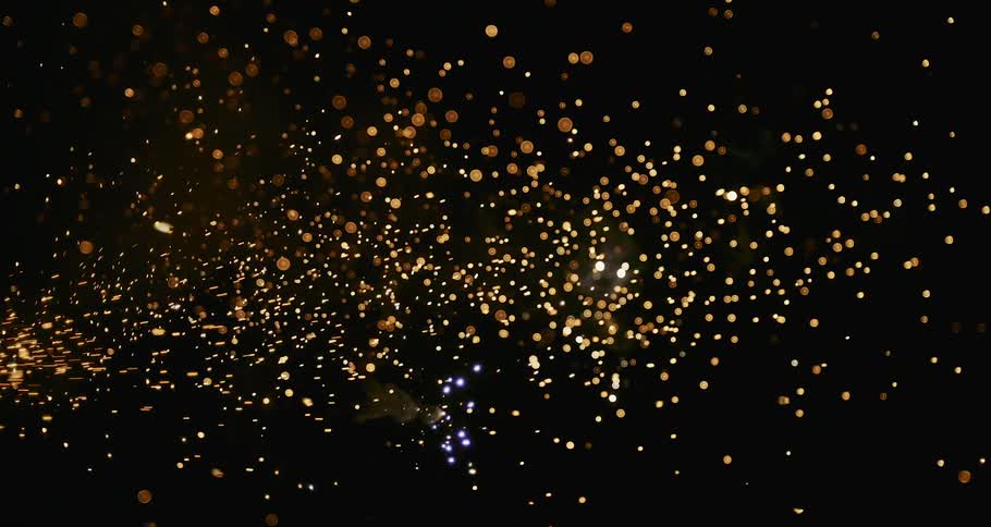 A dazzling fireworks display illuminates the night sky with bright and flashy bursts