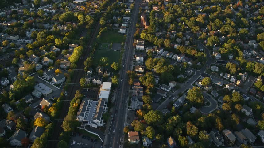 Aerial of a neighborhood with trees surrounding the houses