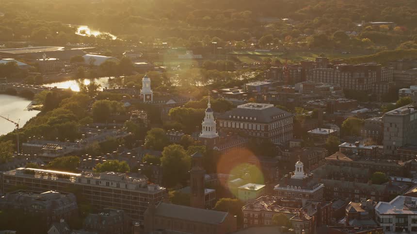 Panorama of a city by the sea with the late afternoon sun reflecting on the water