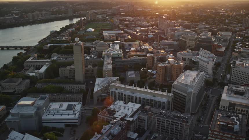 An aerial view of a large city with several buildings and a river