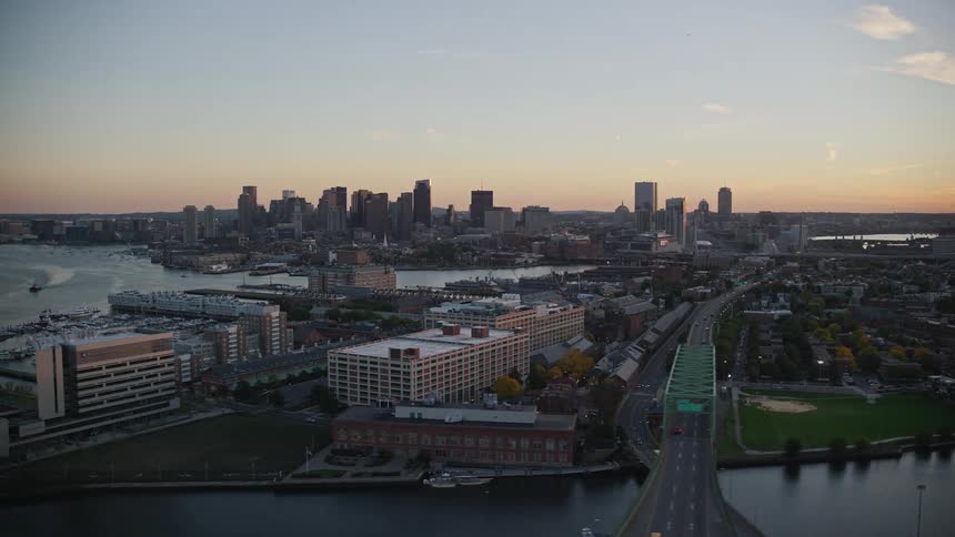 Aerial view of a city with a bridge and river