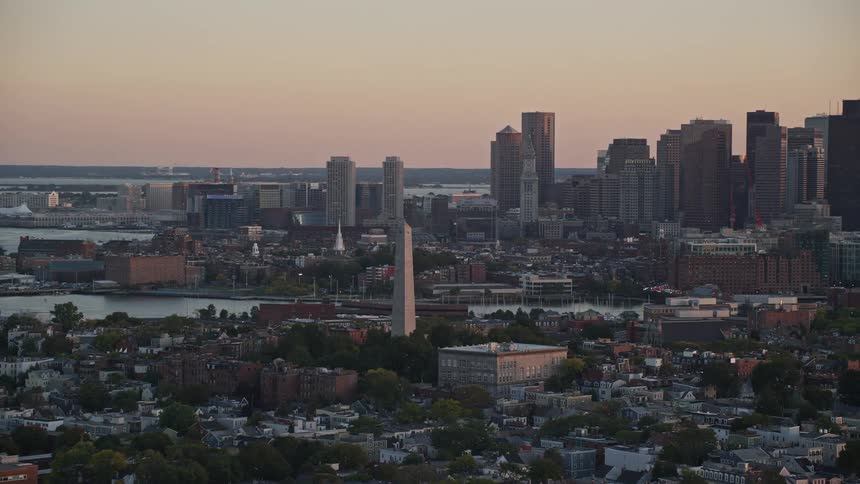 Aerial panorama of a coastal city at dawn