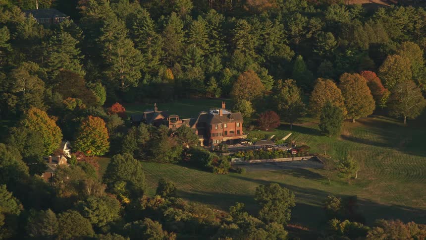 A large house in a rural area at dawn