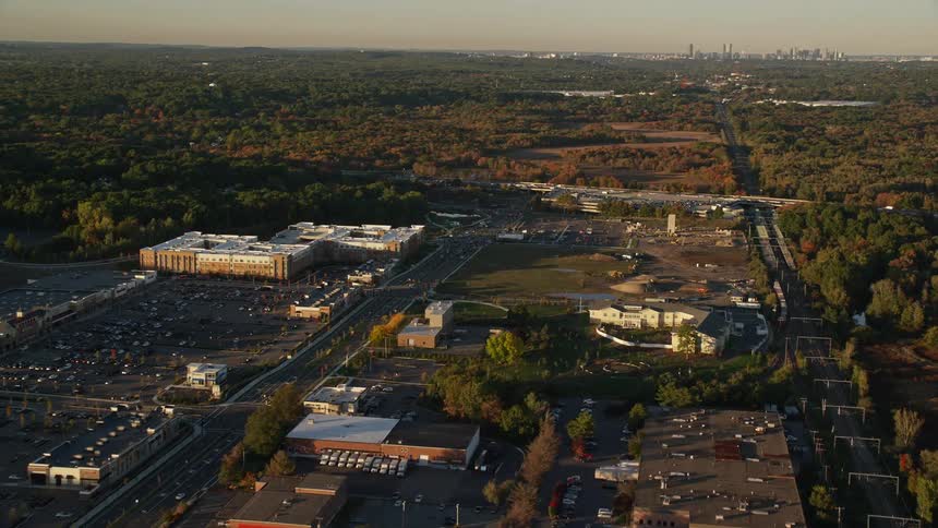An aerial view of a smaller part of a city with some dispersed buildings