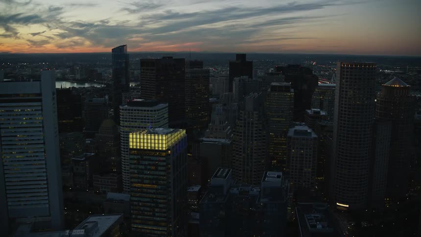Aerial panorama of a city with tall skyscrapers during the night