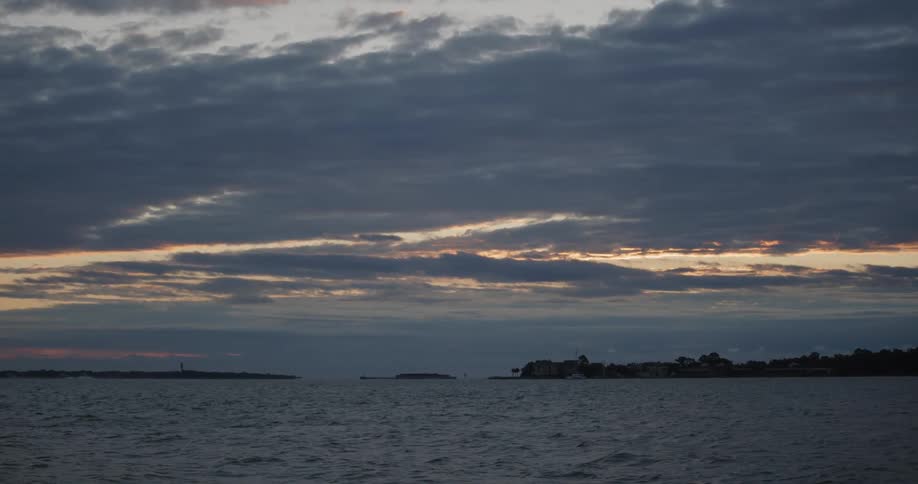 Coastline with calm sea at sunset