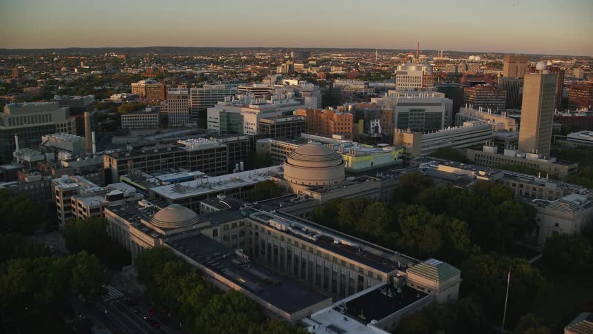 Aerial view of a waterfront city at evening