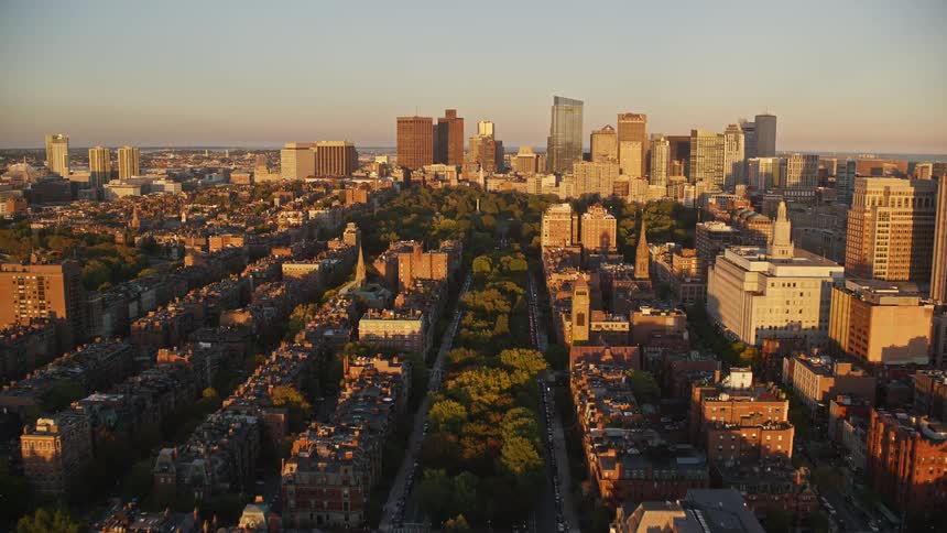 Aerial panorama of a coastal metropolis with skyscrapers in the morning