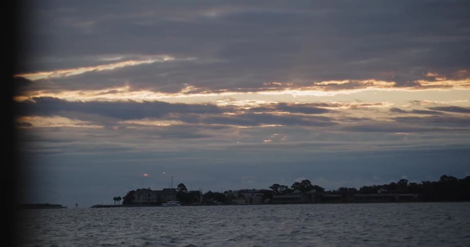 A small coastal town bathed in sunset