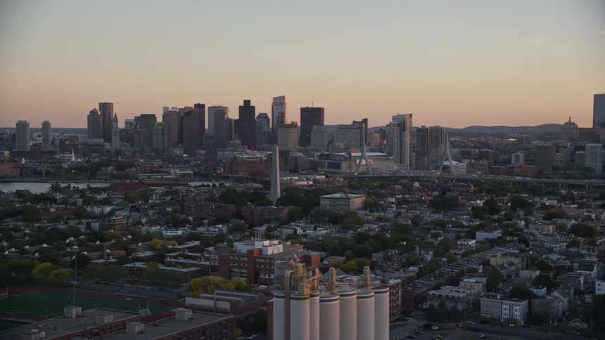 Aerial panorama of a metropolitan city by the seaside with the dawn sky