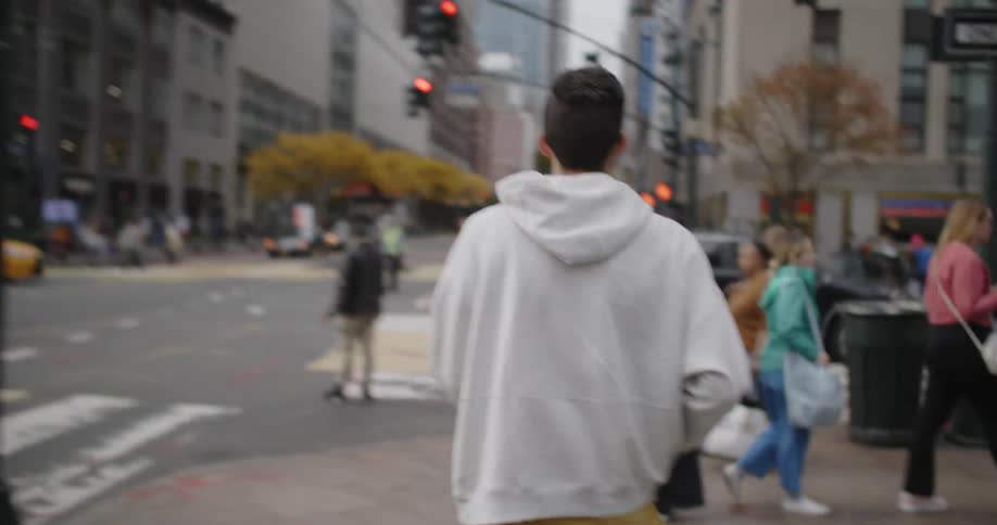 Man walking in a metropolis with his back turned