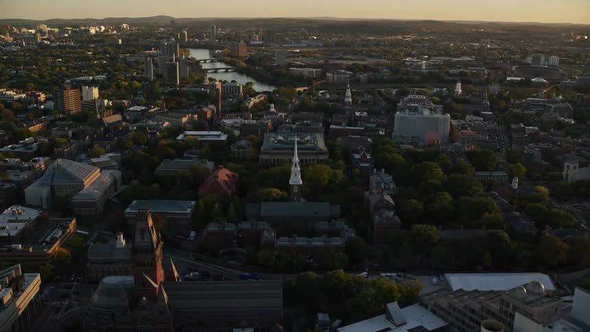 An aerial view of a city with several buildings and trees