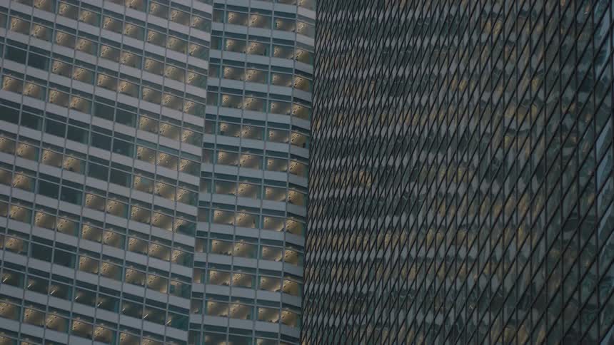View of a skyscraper building entirely covered in mirrors