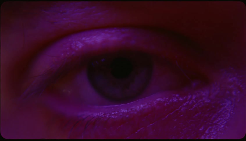 Portrait in the eyes of a man with black lights