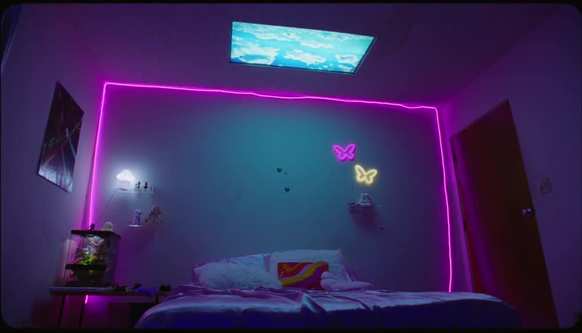 Bed wall frame and rope light in a bedroom