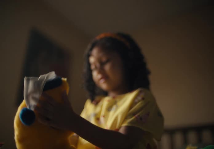 Portrait of a child playing with a plush toy