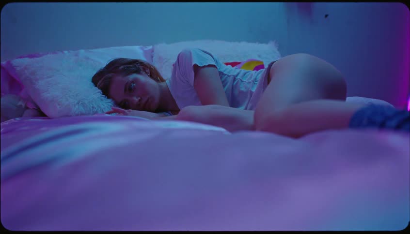 A woman is resting in bed