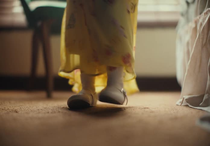 A girl is dancing in the room