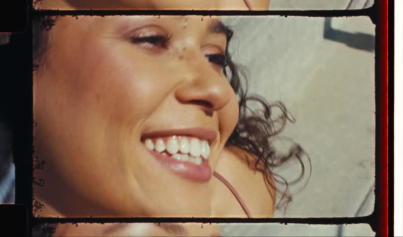 Smiling woman modeling with necklaces around her neck