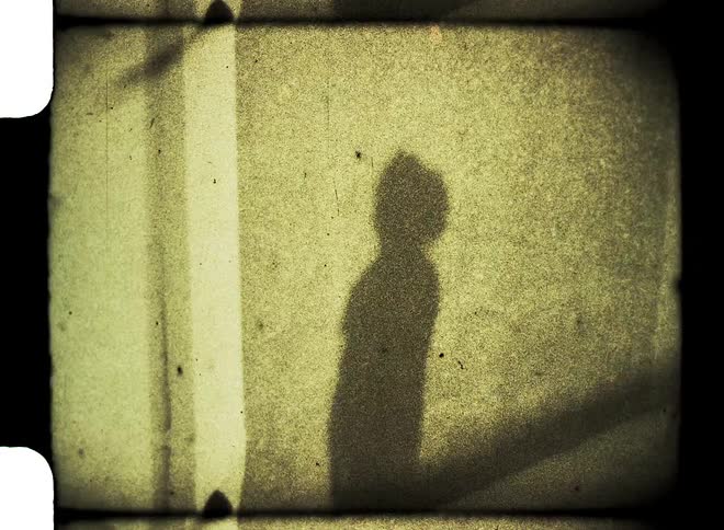 The shadow of a girl is dancing around