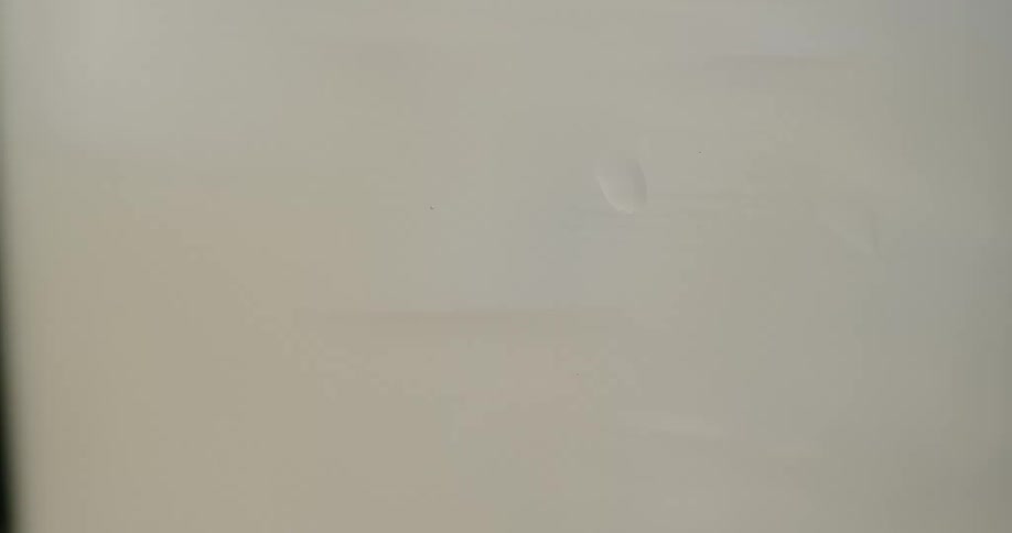 Stirring a fizzy beverage inside a clear glass