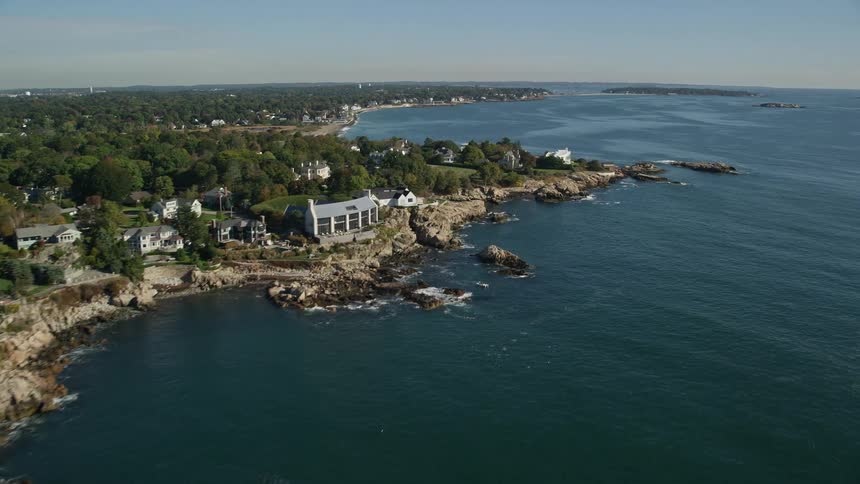 Aerial view of a small coastal town next to the ocean
