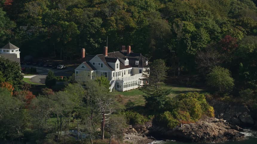 Residential house built on a small hill near a river