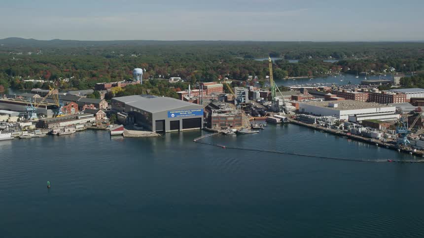 A marina in an industrial region on the coast facing the sea