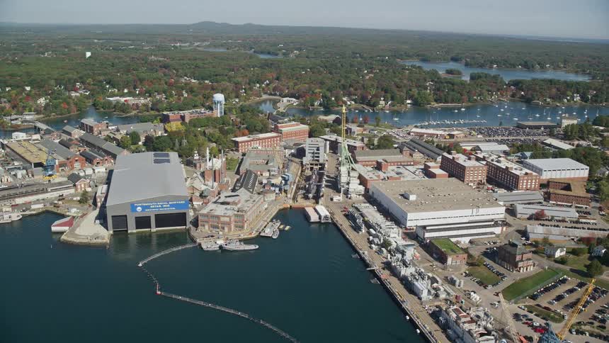 Aerial panorama of a city and factories by the seaside