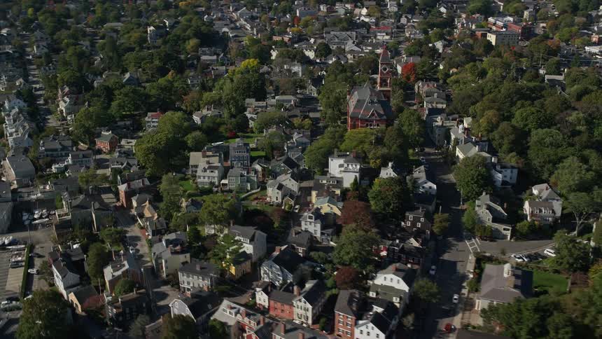 An aerial panorama of an urban city by the seaside