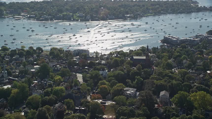 A small town with a bay with small boats in the water