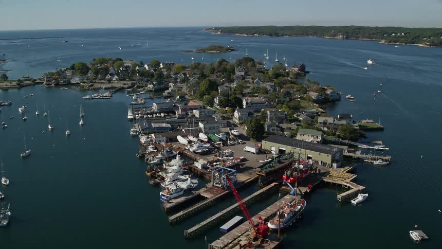Aerial view of islands with urban houses and boats and yachts moored in their vicinity