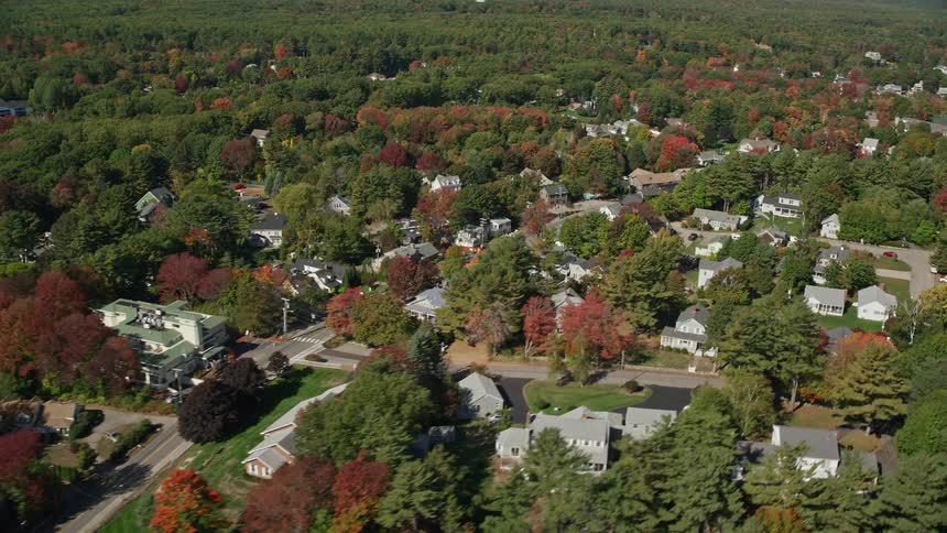 Aerial of a small rural neighborhood with wooden houses