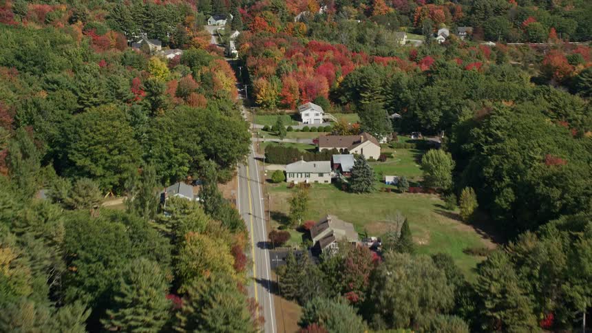 An aerial view of a rural community and a river