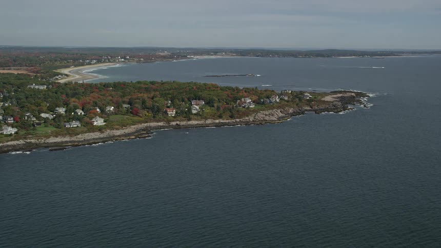 A coastal region with some houses facing the sea