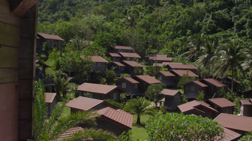Small cottages line the bottom of this mountain