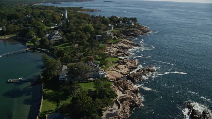 Aerial view of a house at the tip of a seaside peninsula