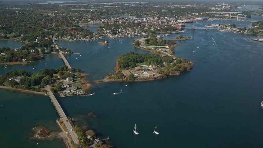 Aerial panorama of a city on islands scattered throughout the sea and connected by bridges