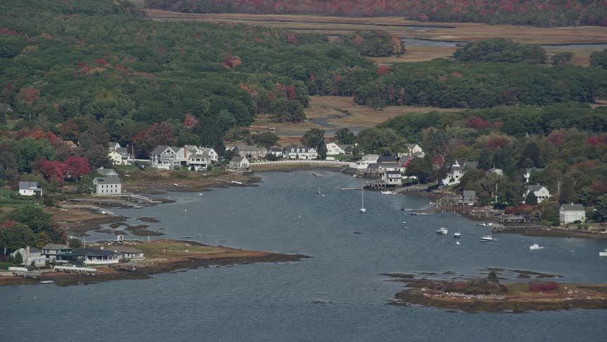 Aerial panorama of houses by the seaside with yachts