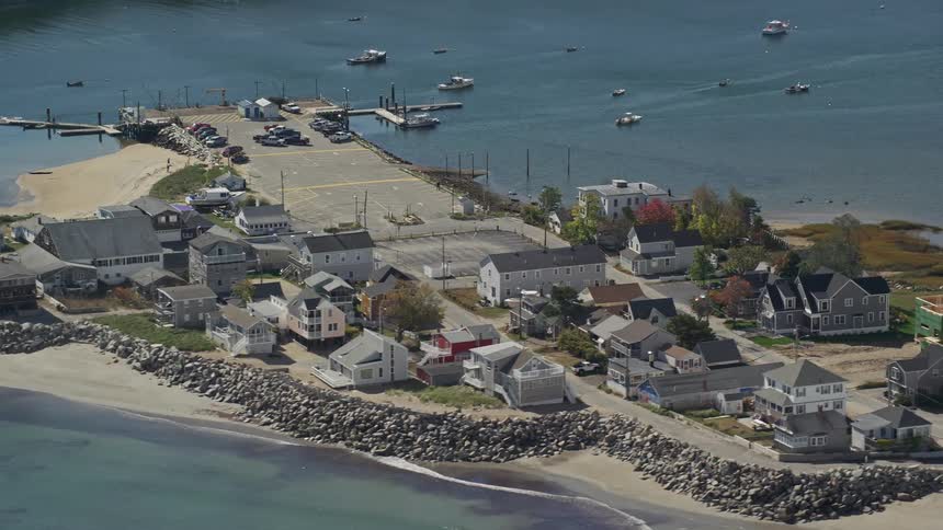 Aerial panorama of a small island with urban houses by the seaside